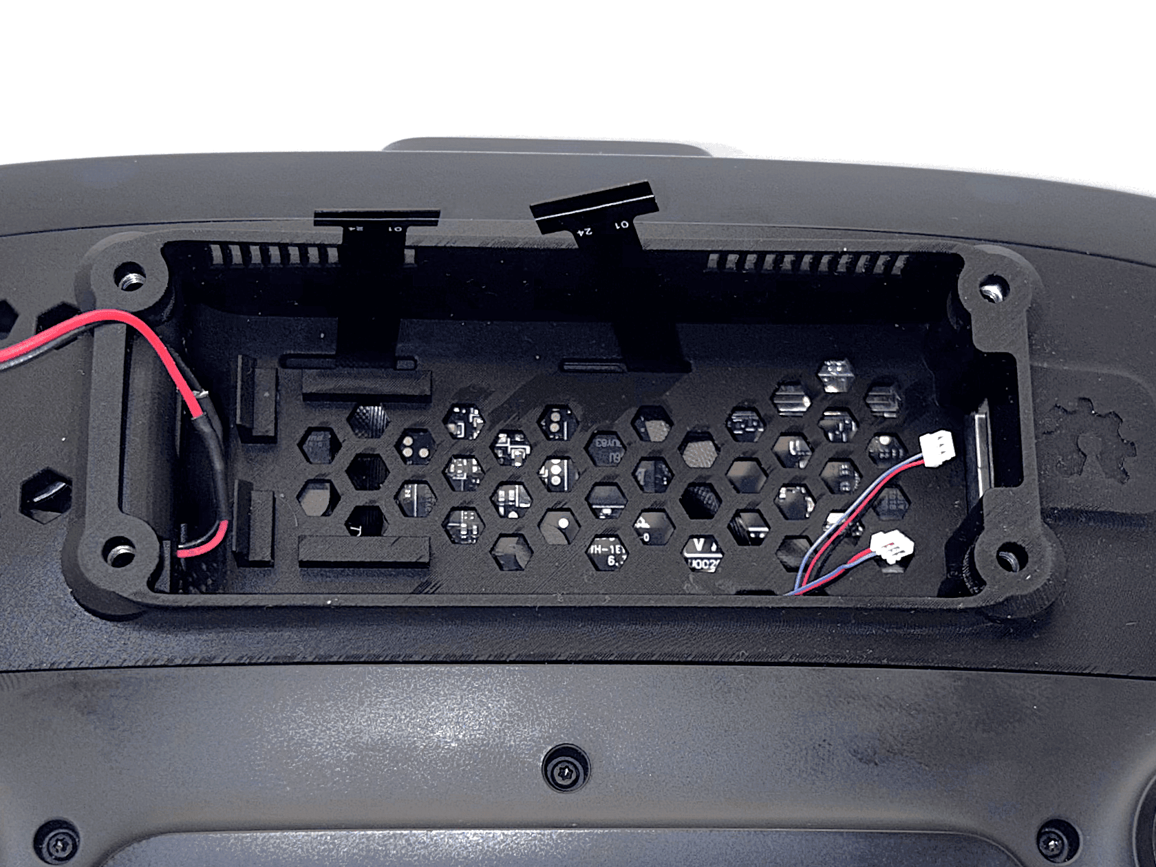 Gold contacts of ribbon cables facing upward in the passthrough