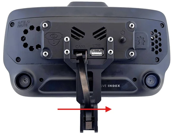 The Index seen from the front, with a red arrow showing the long screw being inserted from the left through the face tracking module and into the nut on the right