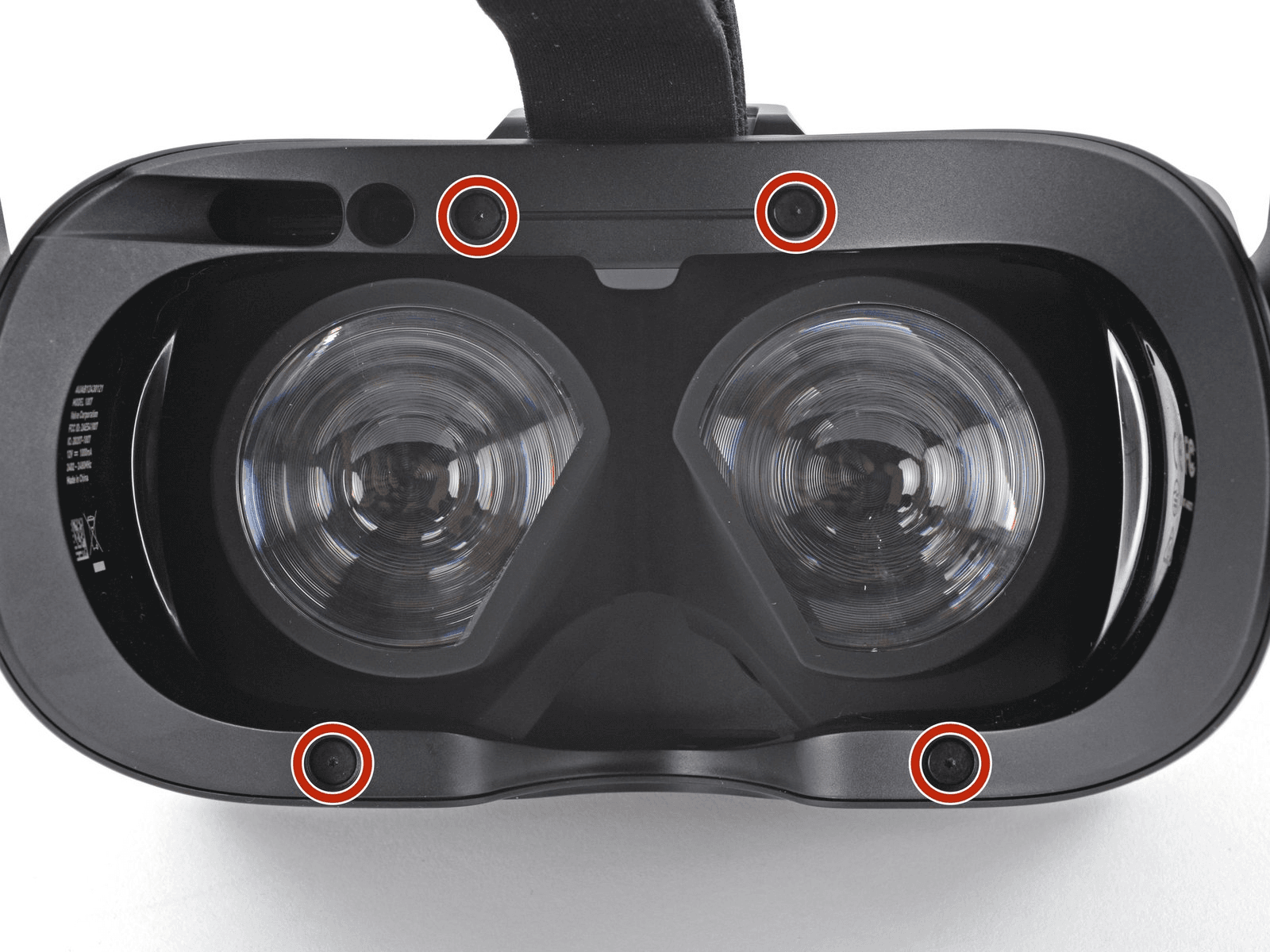 Four T5 Torx screws highlighted on the headset