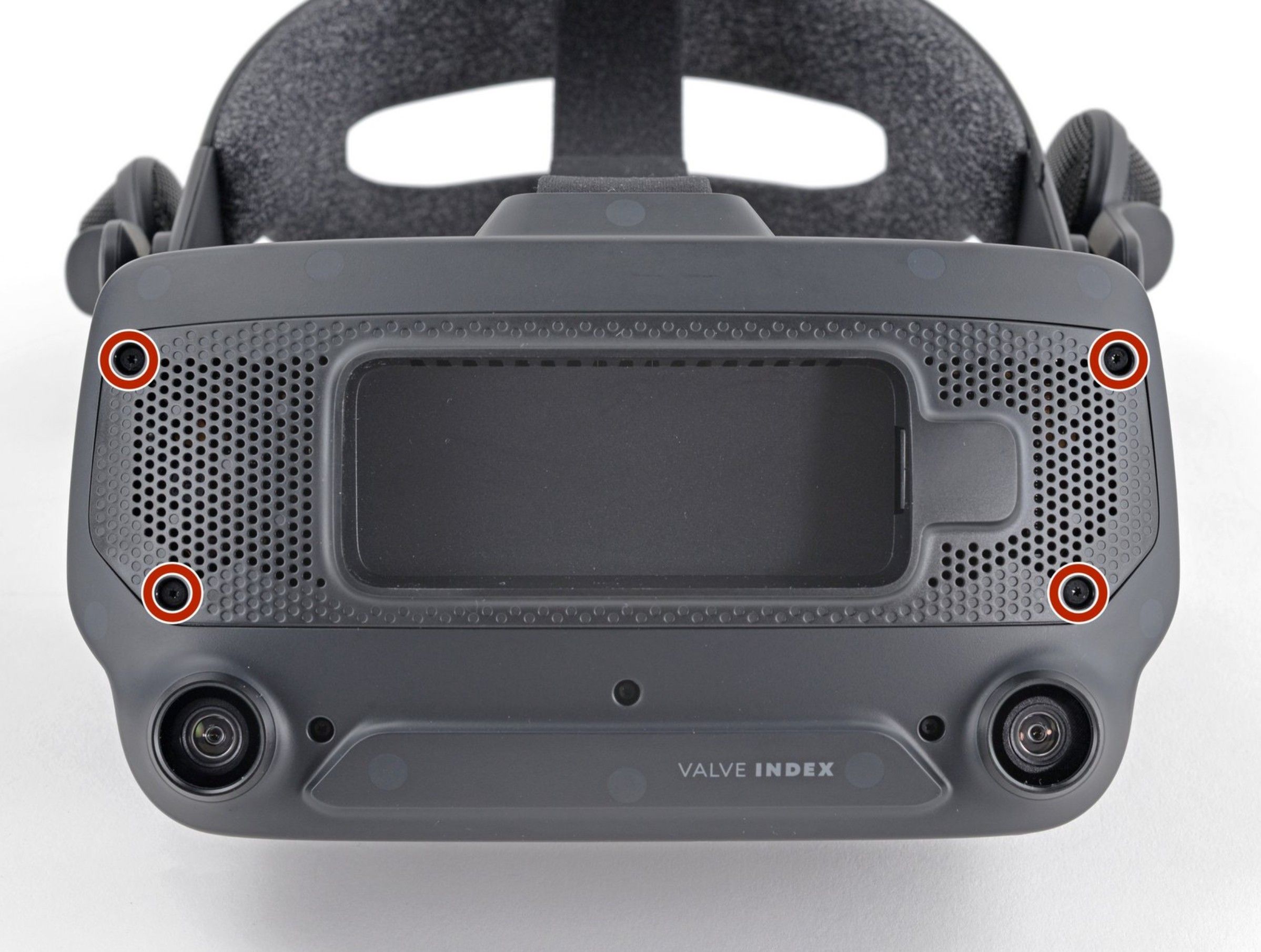 Four T5 Torx screws highlighted on the motherboard cover