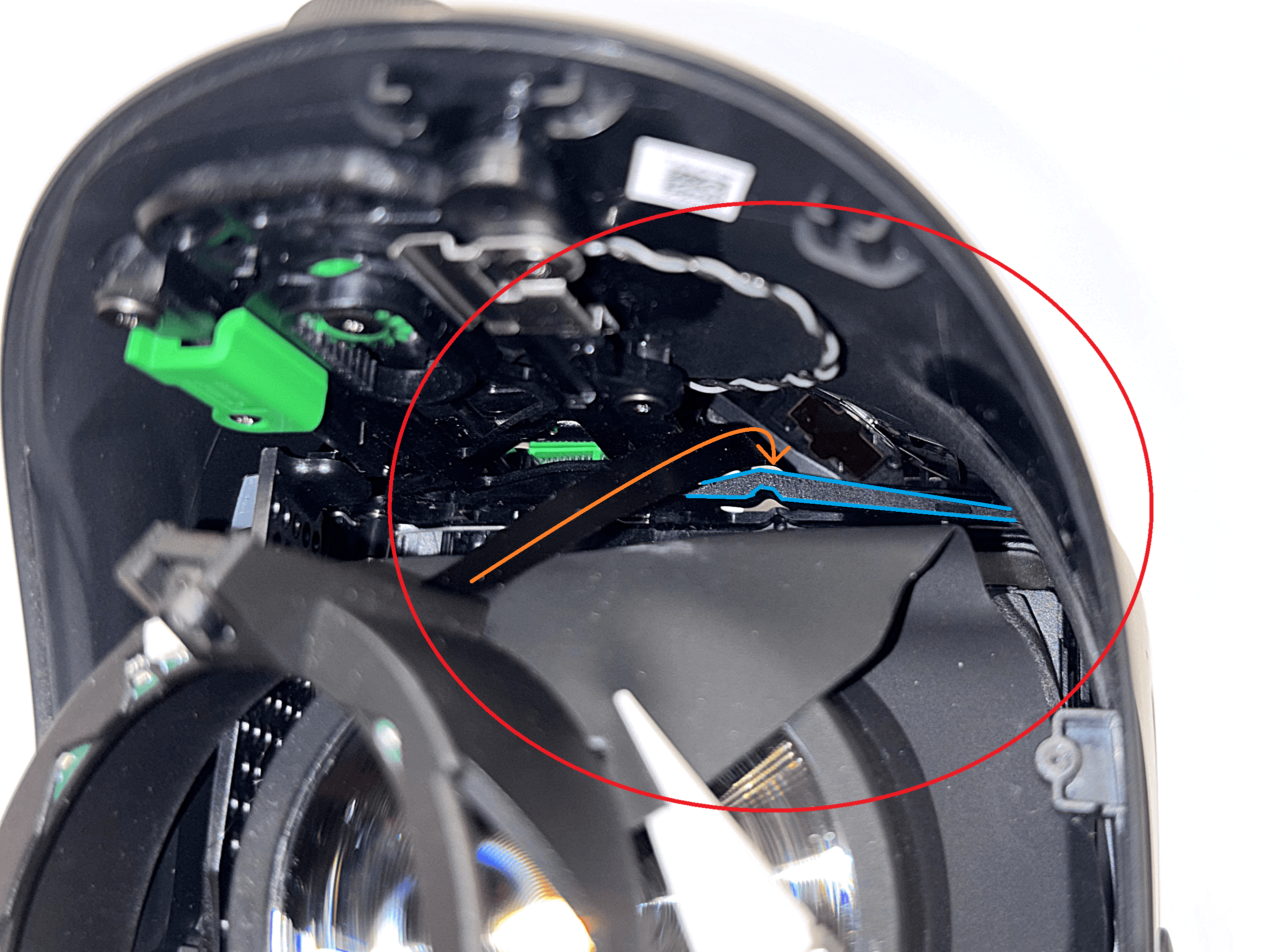 Guiding the right ribbon cable behind the plastic piece