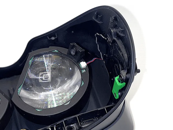 Ring pressed onto lens with excess cable pulled through