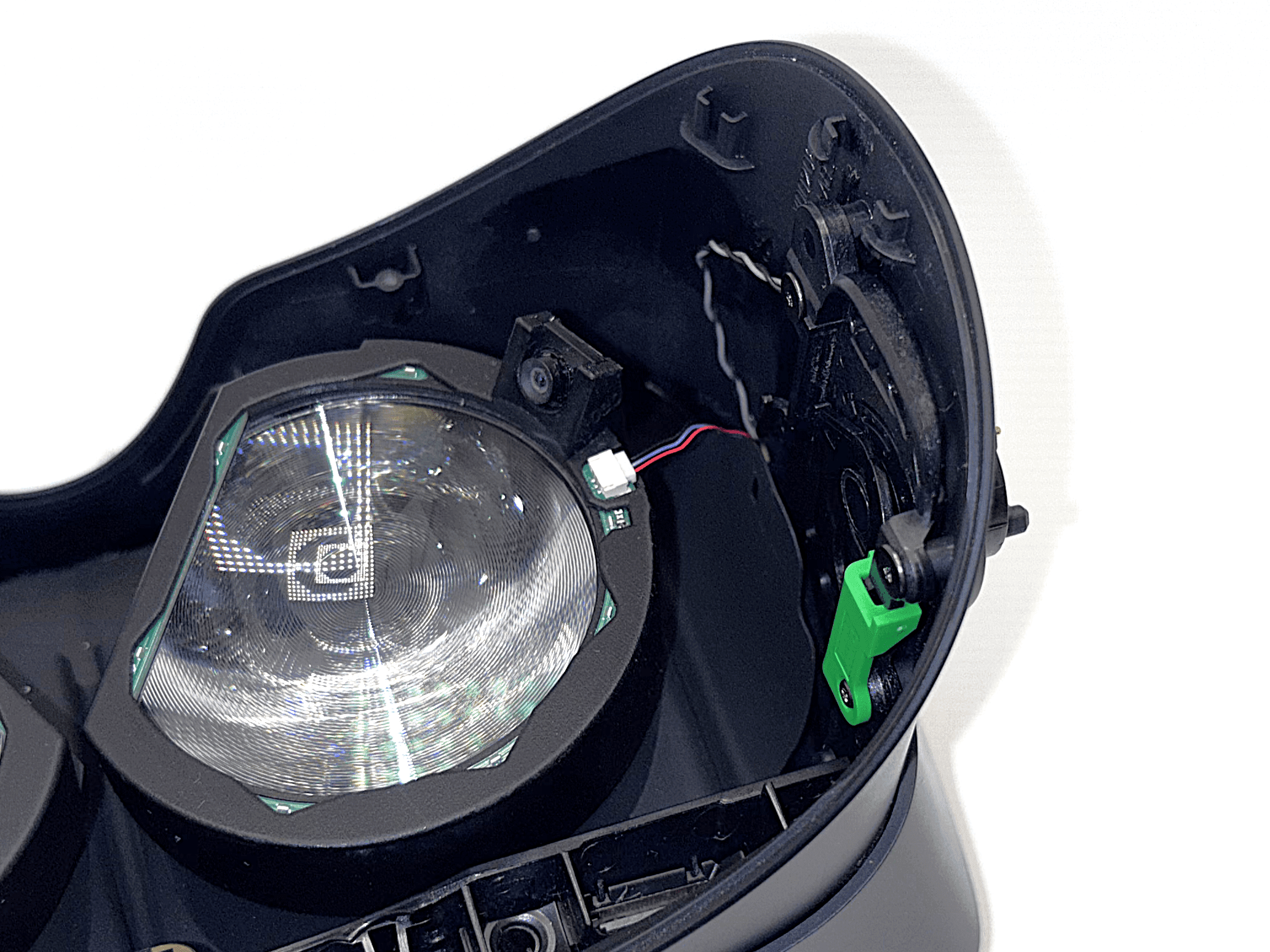 Ring pressed onto lens with excess cable pulled through